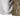 Close-up of a brown camouflage sleeve with UPF 50+ text above the cuff. 