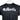 Close-up of a black short-sleeve t-shirt with a black camouflage pattern, featuring a large silver 'Bass Cat' logo across the chest.